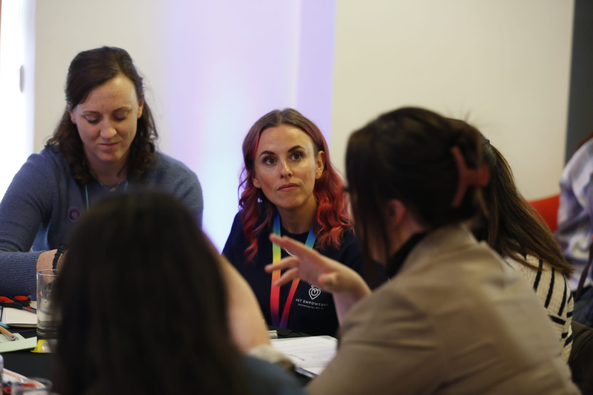 Small group in conversation around a table at a Vet Empowered workshop